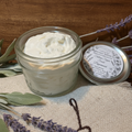 Hightower Tallow Co. Peppermint Tallow Sugar Scrub in an open glass mason jar with botanical label, styled with dried lavender and sage on linen and wood